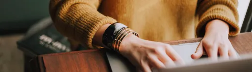 close-up hands on laptop 